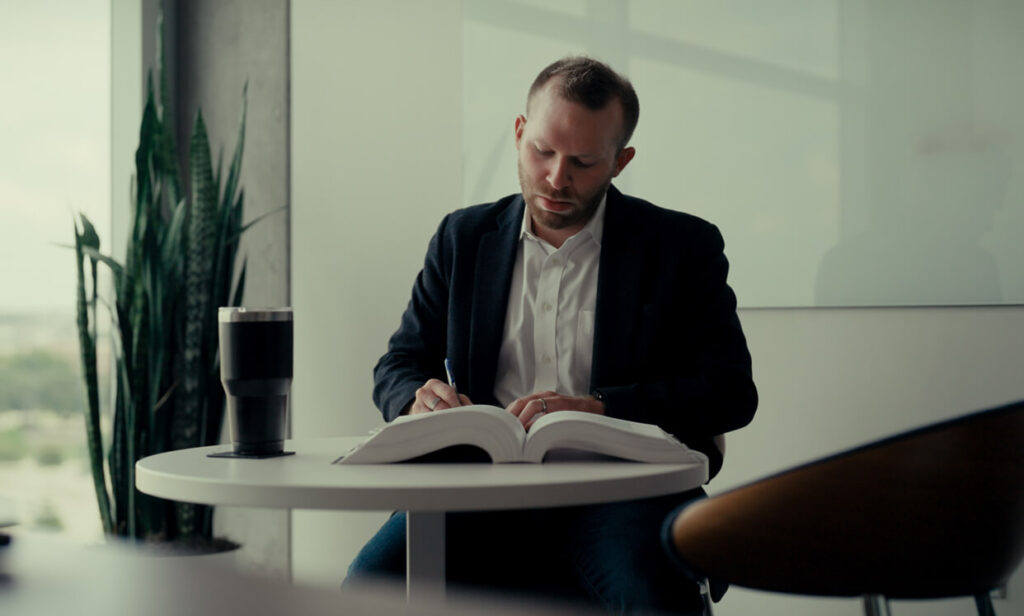 Accelerate Employee working at his desk.