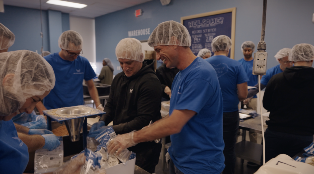 Group of people packing food supplies